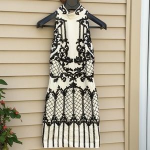 Bebe swirl beaded mock neck dress.